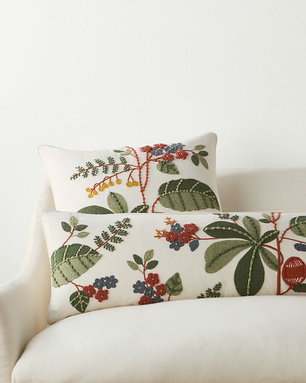 Intricate floral embroidery design detail by expert pillow cover manufacturers in India.